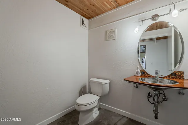 a bathroom with a toilet and a sink