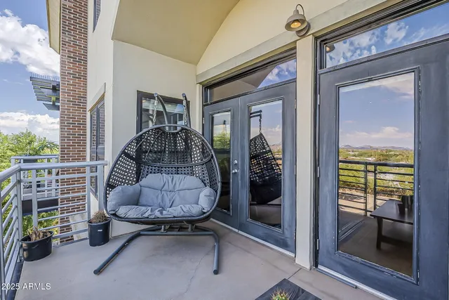 a front view of a house with outdoor seating