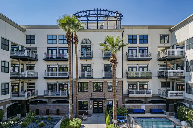 a front view of a building with many windows