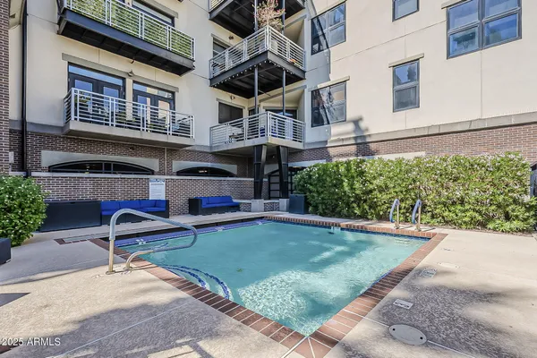 a view of a patio with table and chairs and potted plants