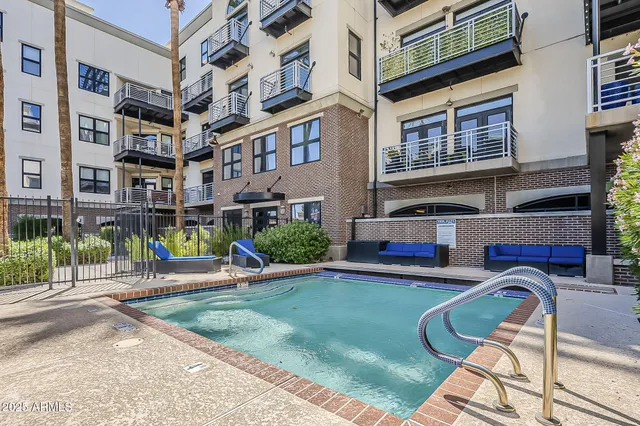 a view of a building with backyard