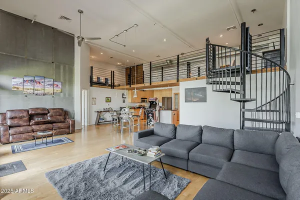 a living room with furniture and a rug