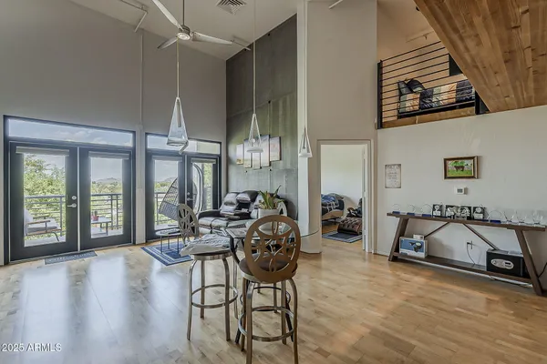 a view of a livingroom with furniture and a window