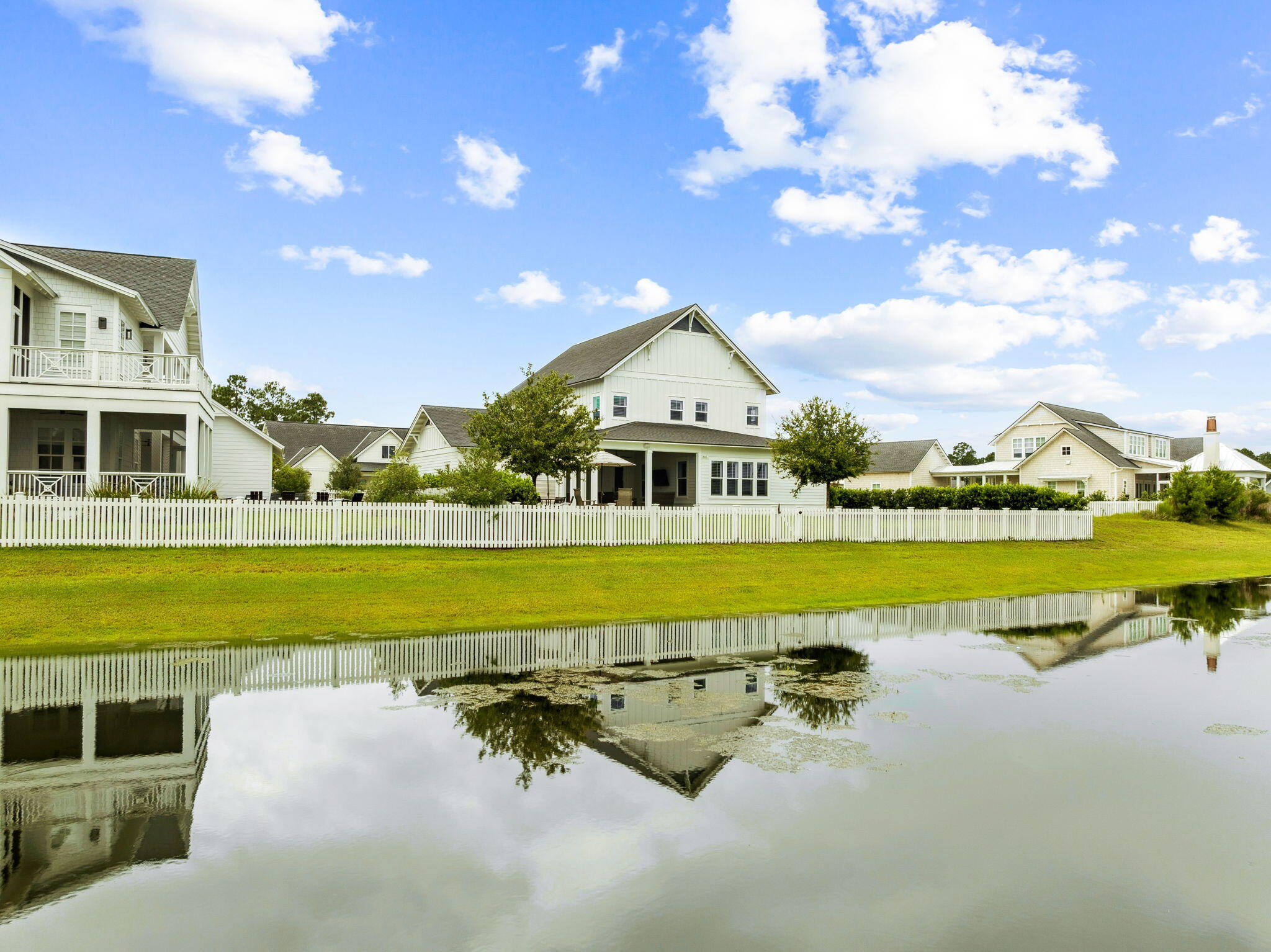 121 Needle Cast Ln Inlet Beach Inlet Beach, FL 32461 - Photo 2 of 63 a view of a house with a swimming pool and a yard