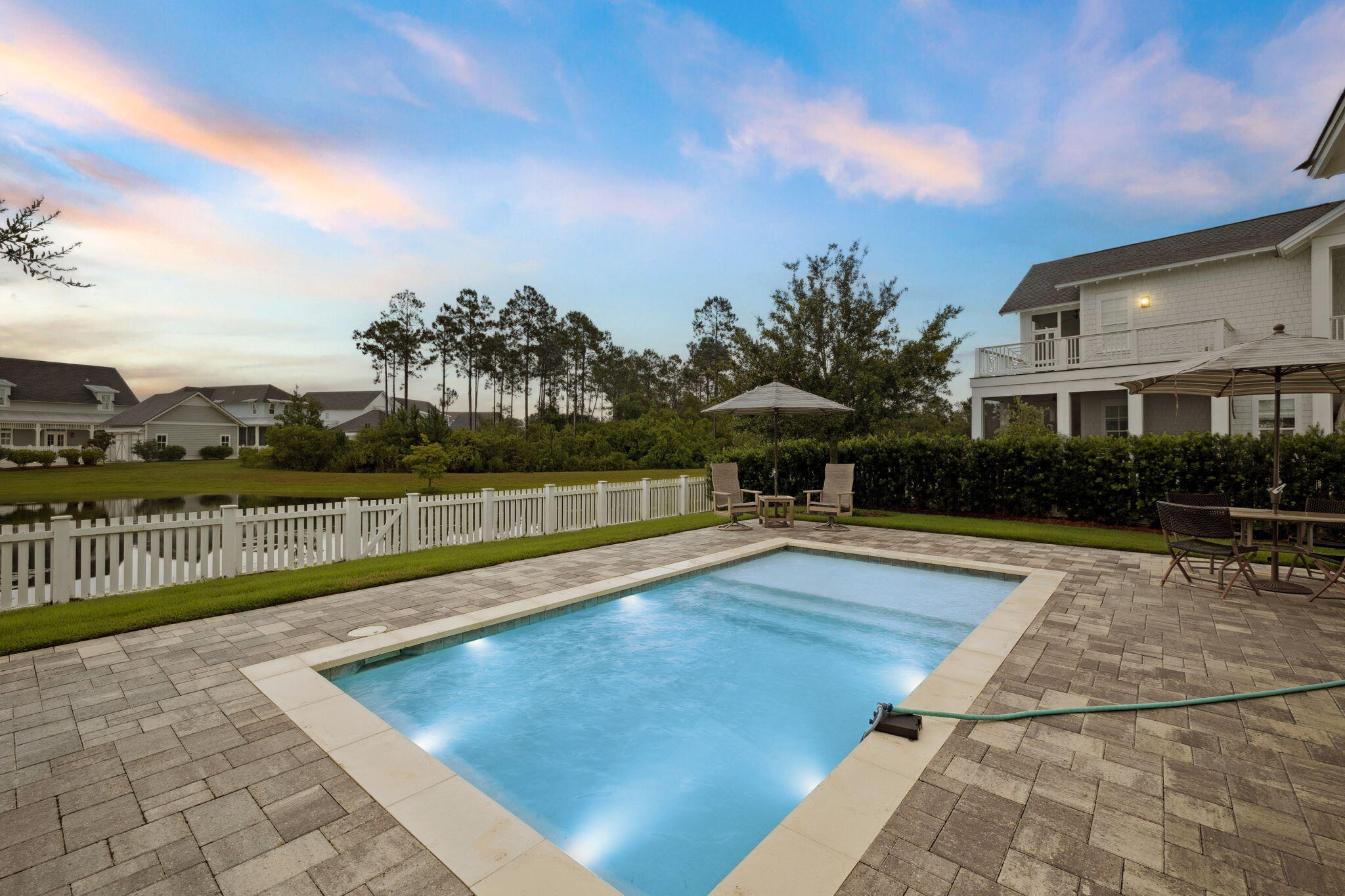 121 Needle Cast Ln Inlet Beach Inlet Beach, FL 32461 - Photo 6 of 63 a view of swimming pool with seating space and trees in the background