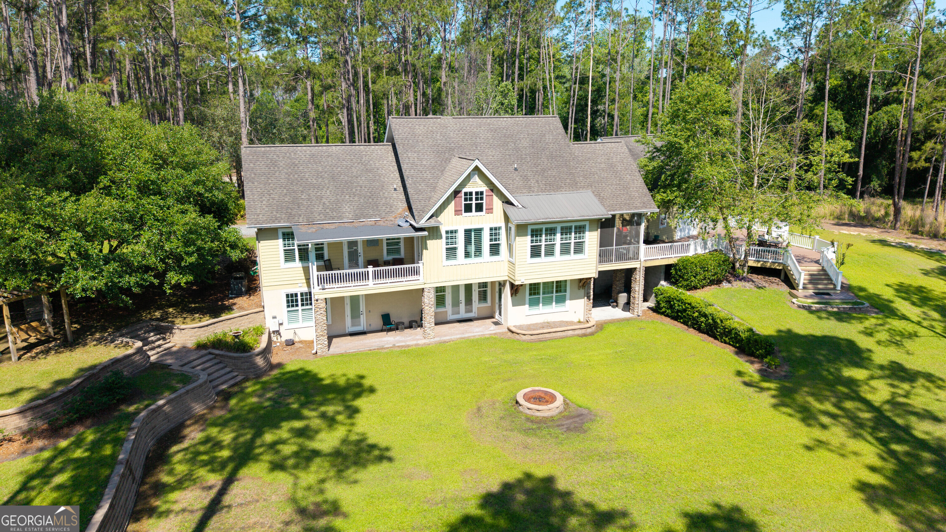 300 Hammond Powell Road Hazlehurst, GA 31539 - Photo 4 of 91 an aerial view of a house with swimming pool and large trees