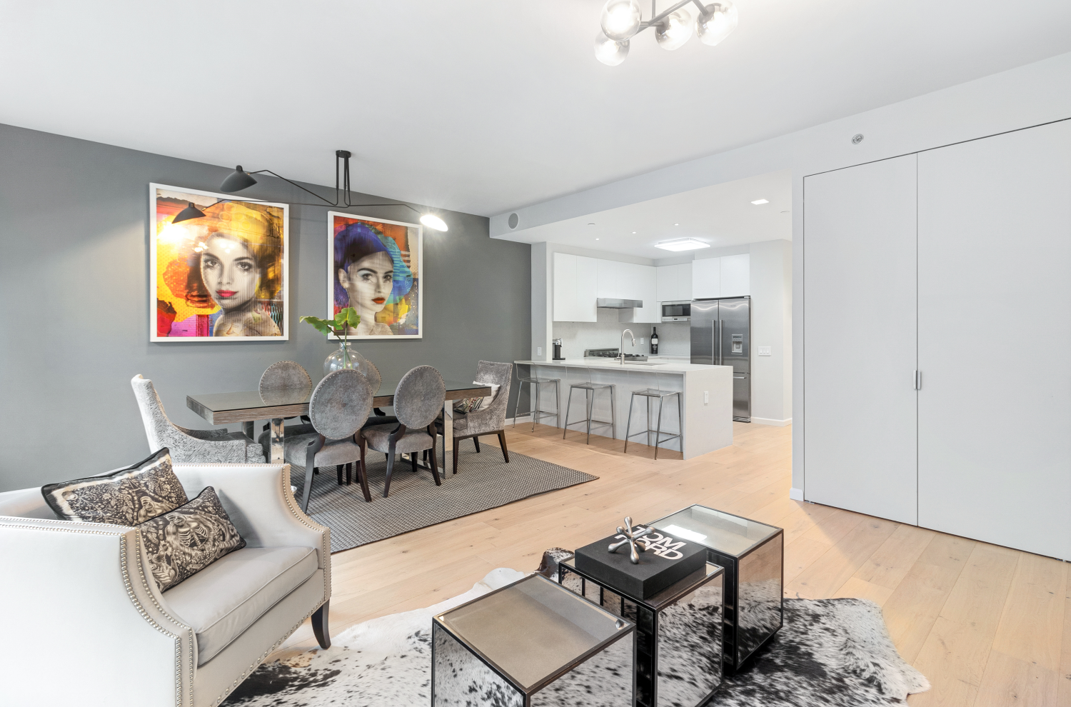 277 East 7th Street, Unit 2 Manhattan, NY 10009 - Photo 3 of 11 a living room with furniture and a table