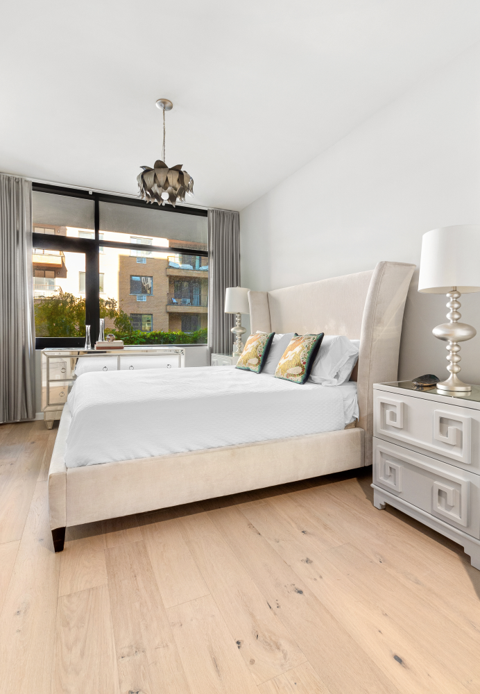 277 East 7th Street, Unit 2 Manhattan, NY 10009 - Photo 7 of 11 a bedroom with a bed and window