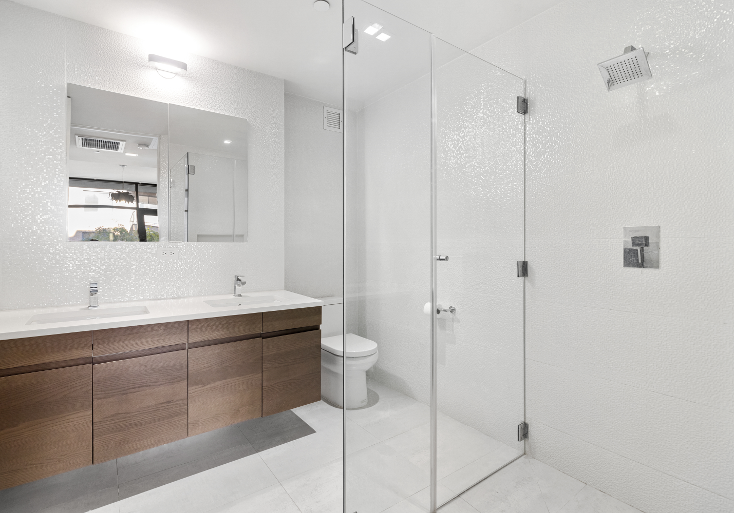 277 East 7th Street, Unit 2 Manhattan, NY 10009 - Photo 8 of 11 a bathroom with a double vanity sink mirror and toilet