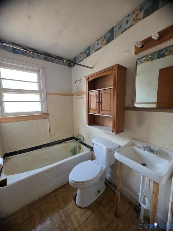 1429 Taro Road Cullen, VA 23934 - Photo 10 of 23 a bathroom with a sink a toilet a mirror and bathtub