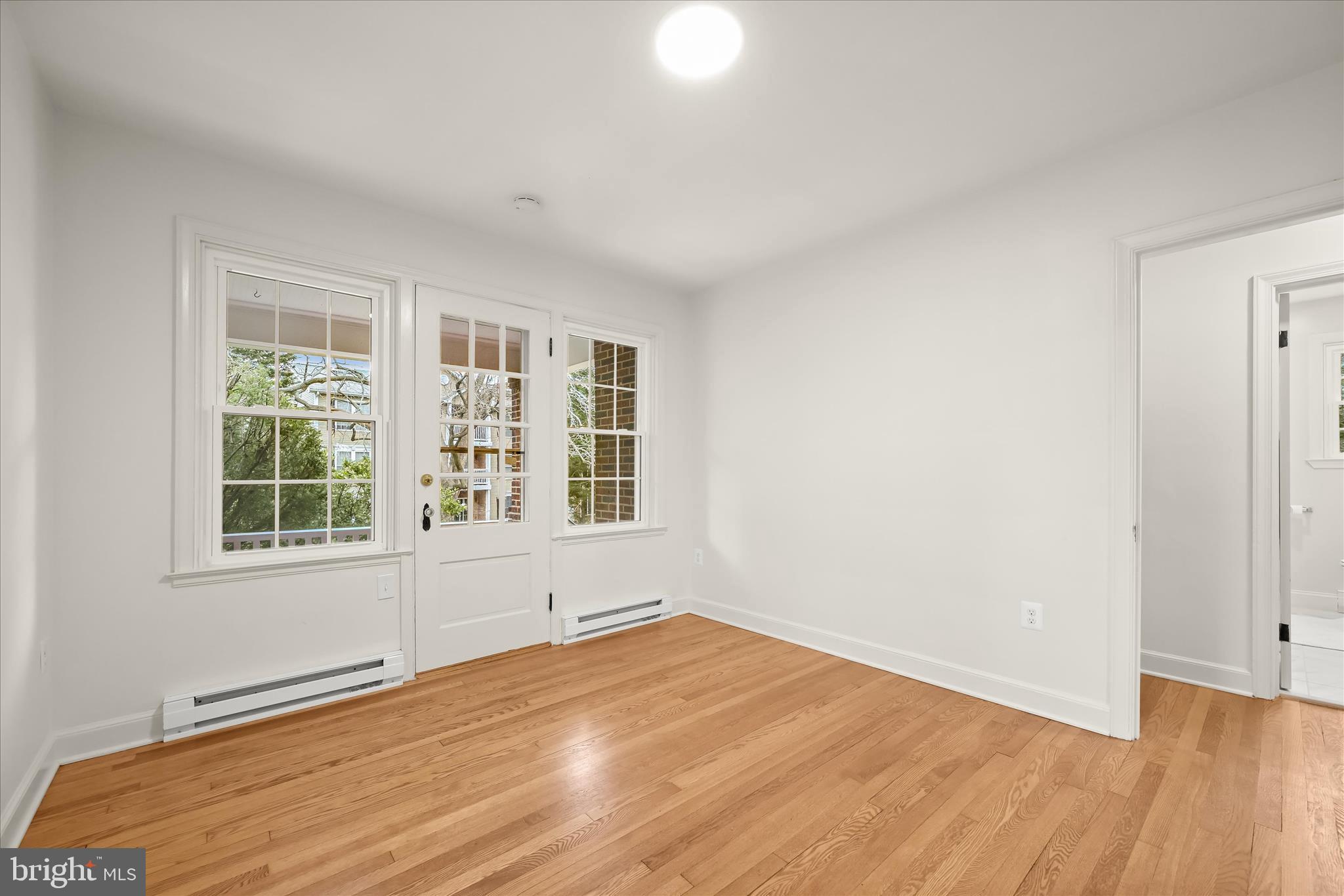 1631 Shookstown Road Frederick, MD 21702 - Photo 15 of 69 an empty room with wooden floor and windows