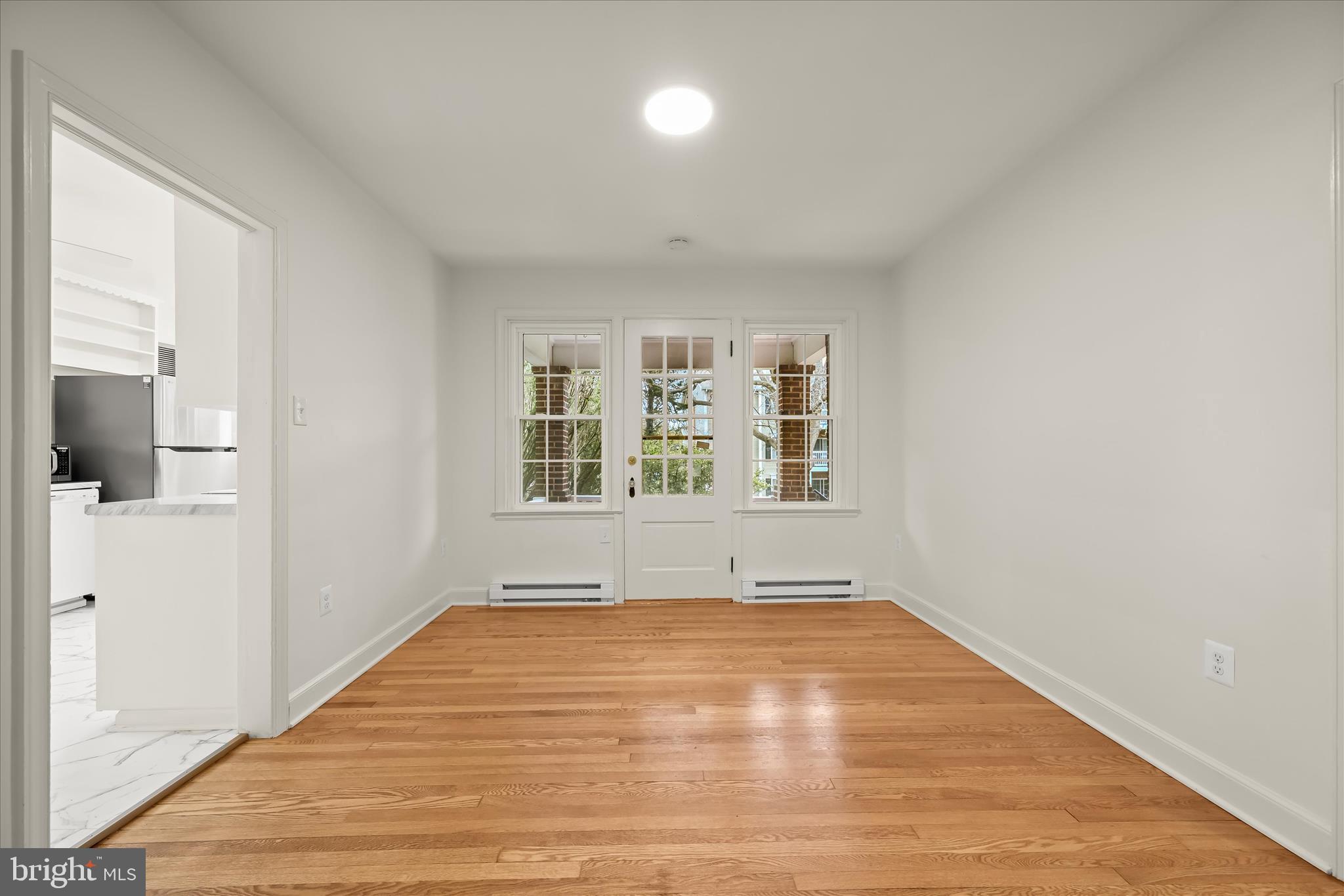 1631 Shookstown Road Frederick, MD 21702 - Photo 16 of 69 wooden floor in an empty room with a window