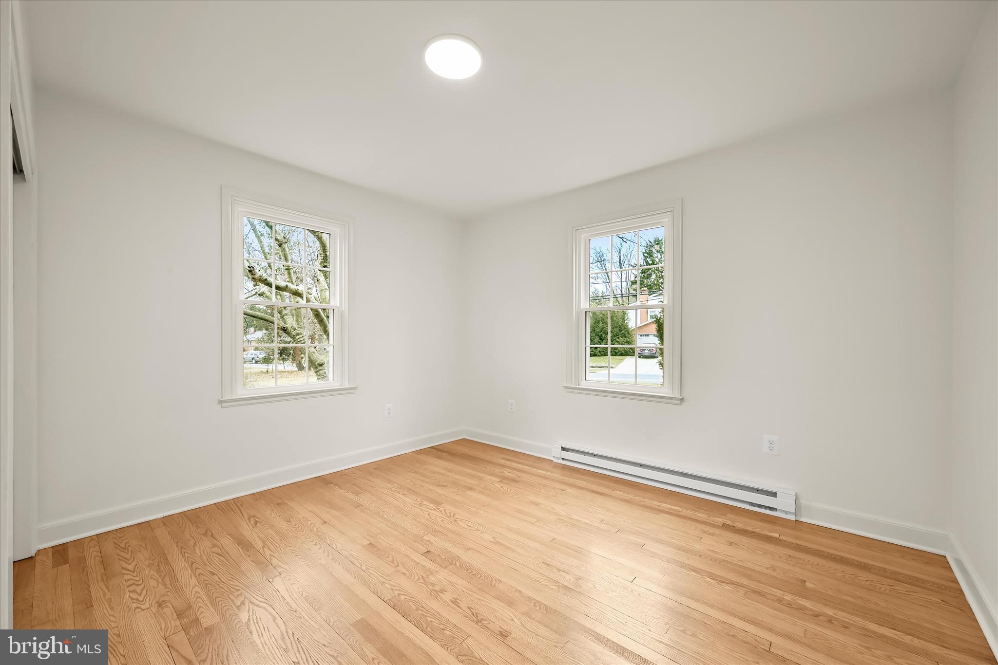 1631 Shookstown Road Frederick, MD 21702 - Photo 22 of 69 wooden floor in an empty room with a window