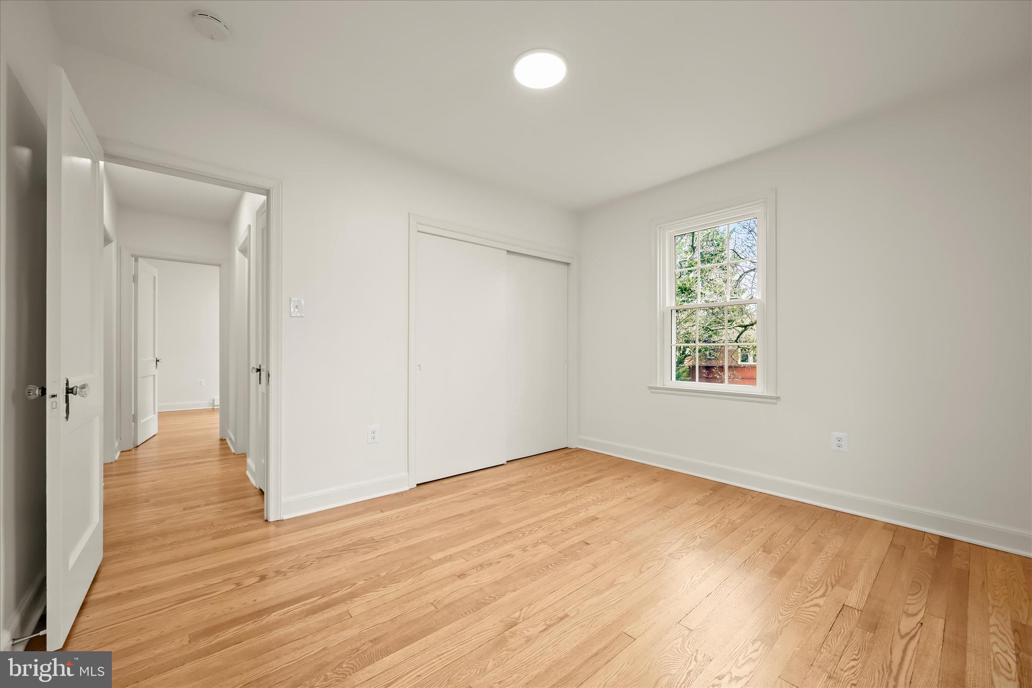 1631 Shookstown Road Frederick, MD 21702 - Photo 23 of 69 an empty room with wooden floor and windows
