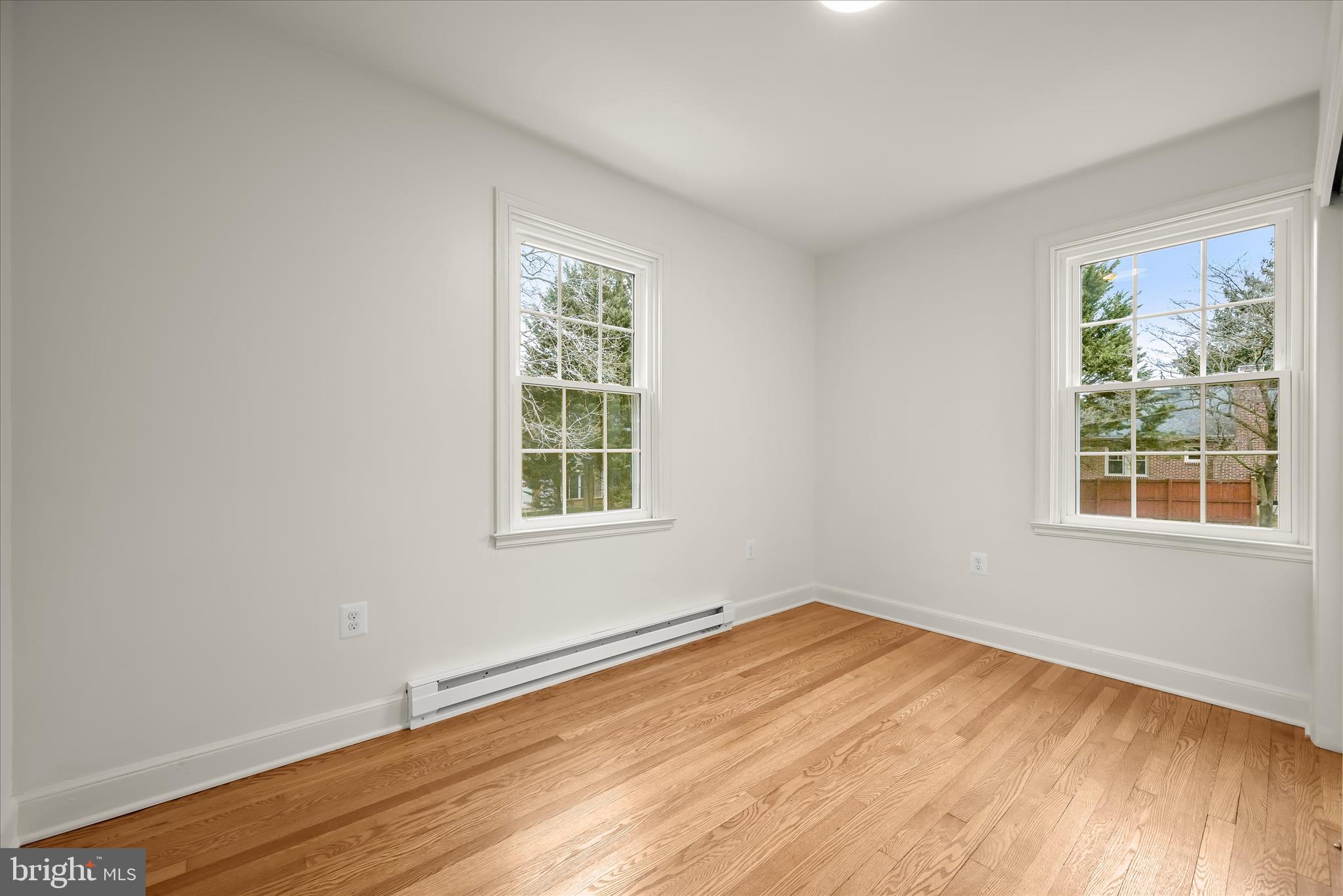 1631 Shookstown Road Frederick, MD 21702 - Photo 26 of 69 an empty room with wooden floor and windows