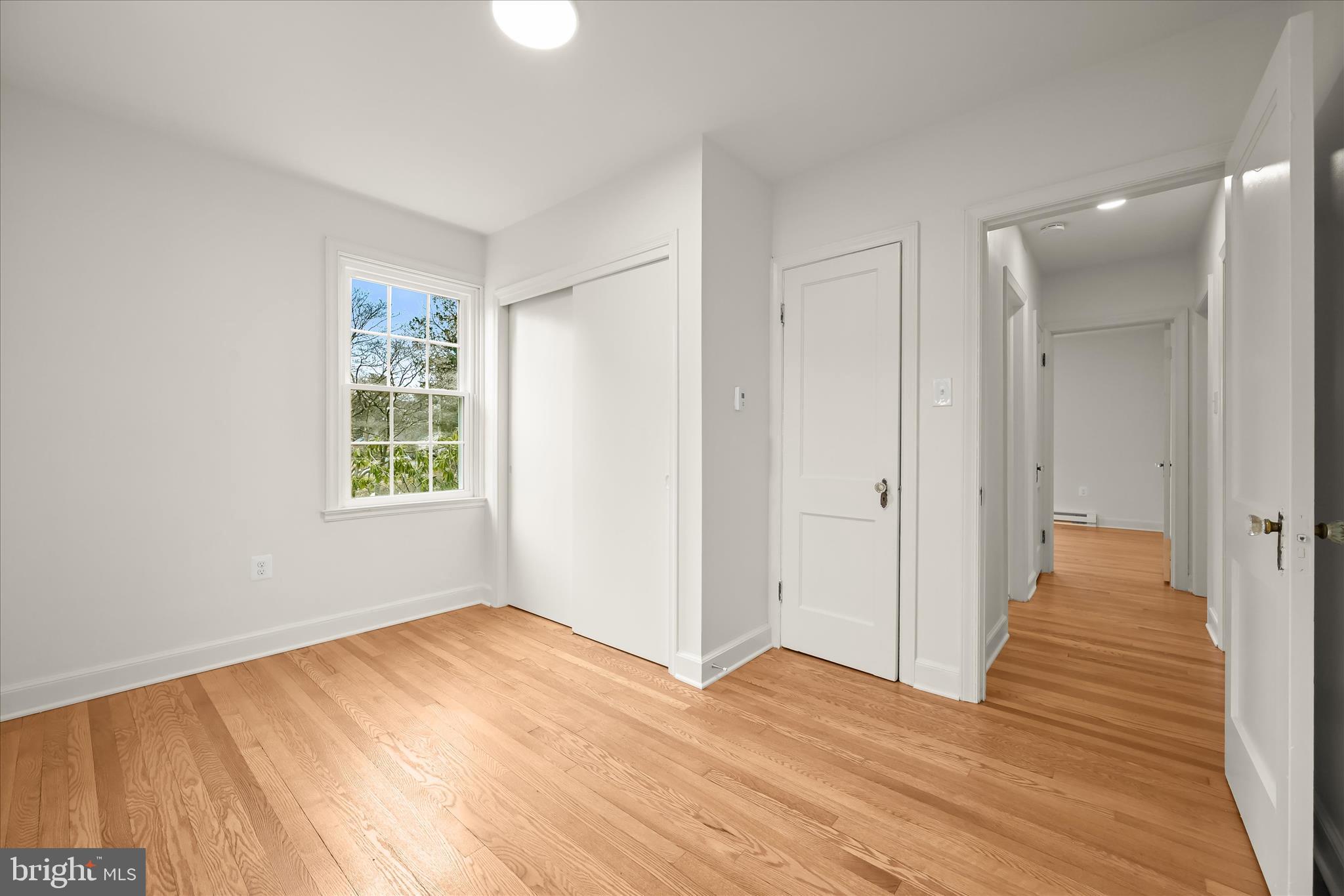 1631 Shookstown Road Frederick, MD 21702 - Photo 27 of 69 wooden floor in an empty room with a window