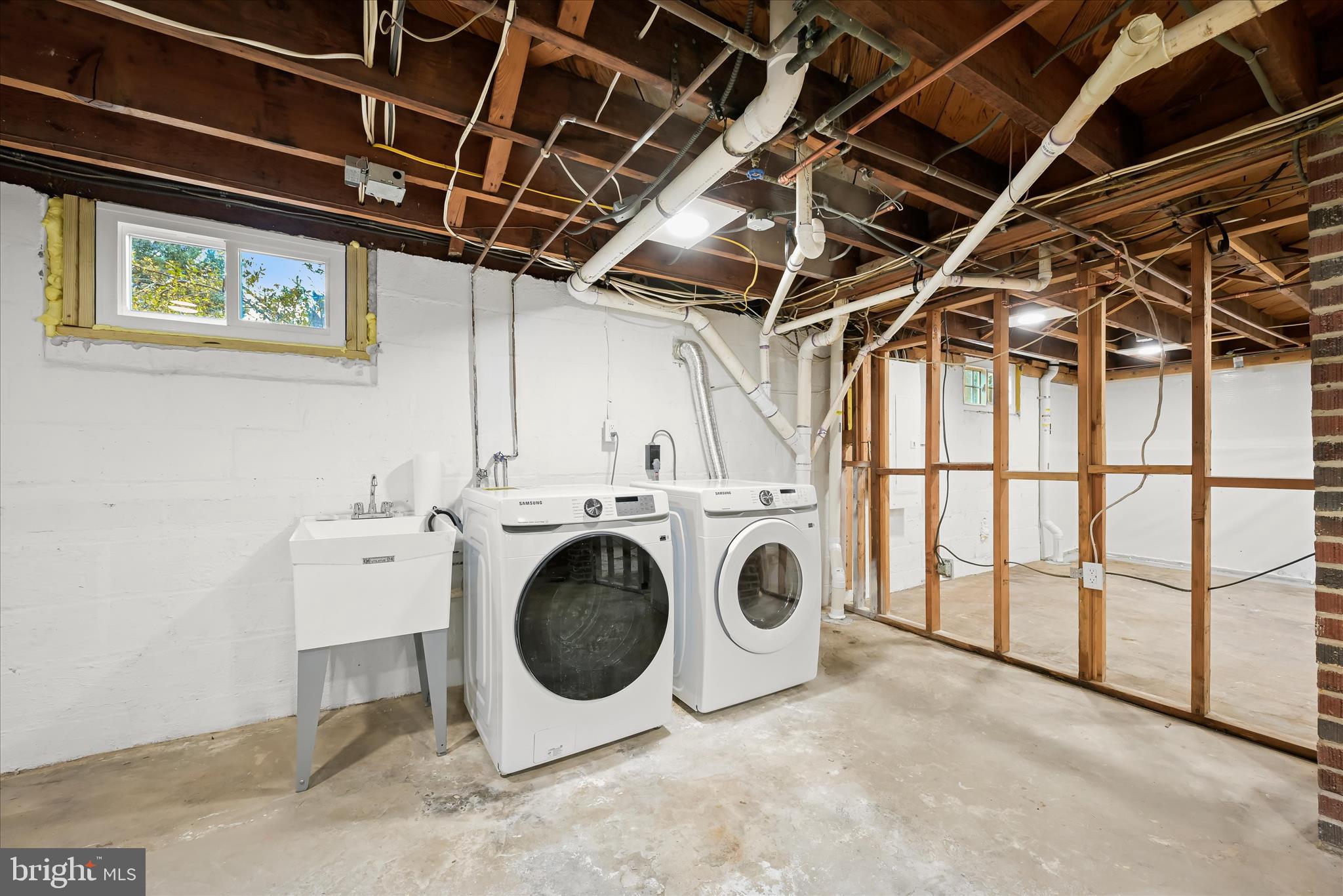 1631 Shookstown Road Frederick, MD 21702 - Photo 43 of 69 a view of a storage & utility room with washer and dryer