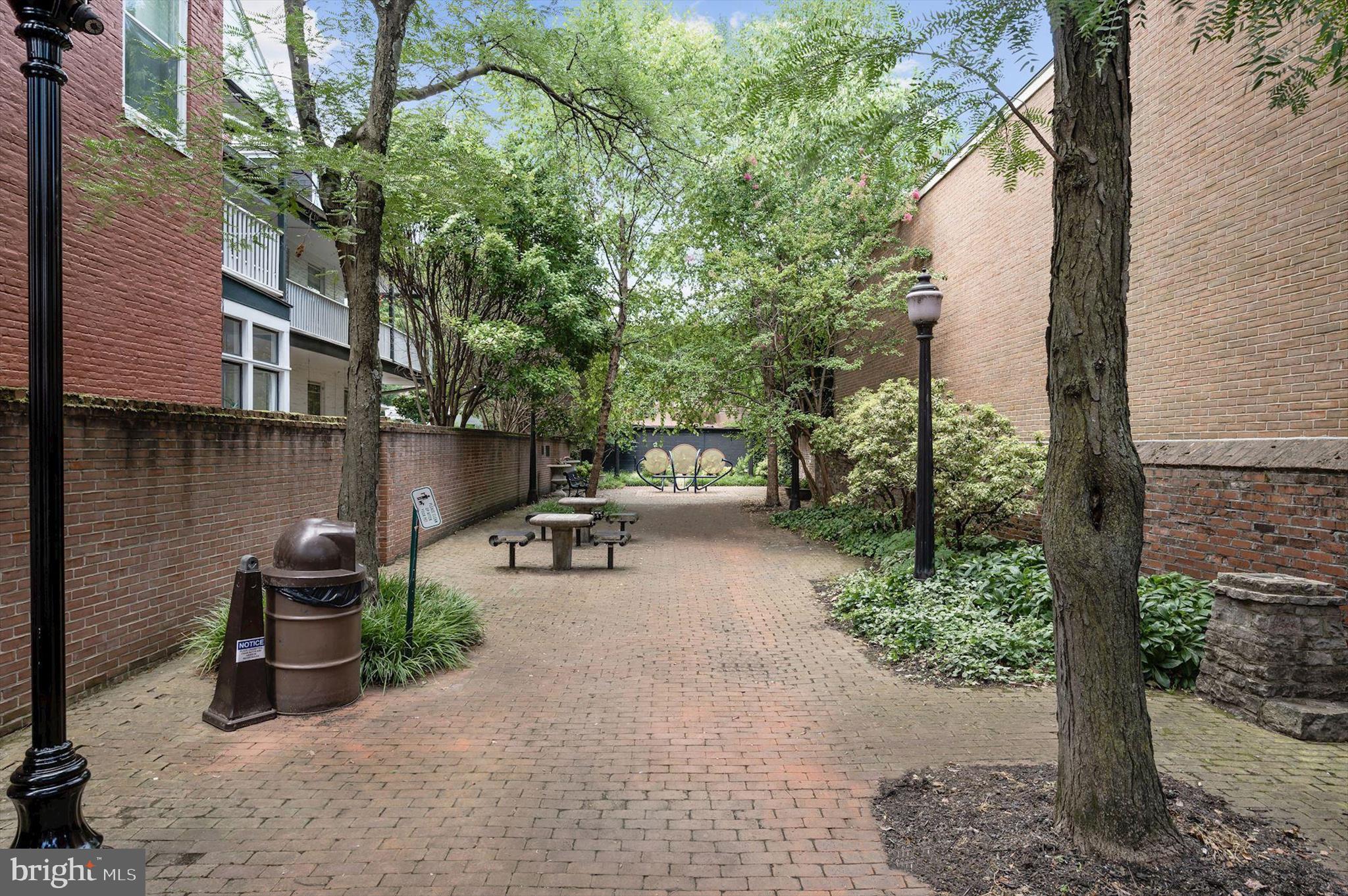 1631 Shookstown Road Frederick, MD 21702 - Photo 68 of 69 a view of a patio with table and chairs and potted plants