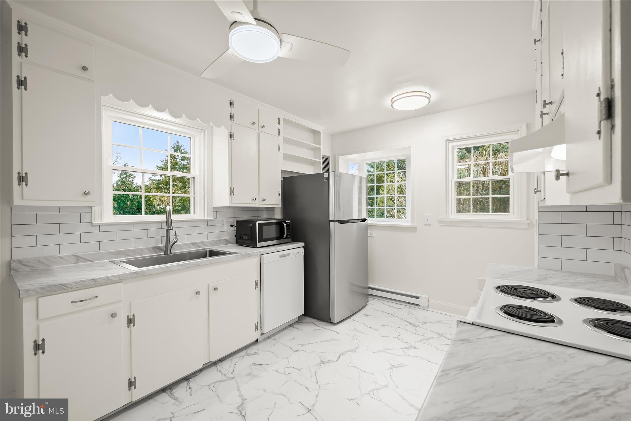 1631 Shookstown Road Frederick, MD 21702 - Photo 7 of 69 a kitchen with a sink stove and refrigerator