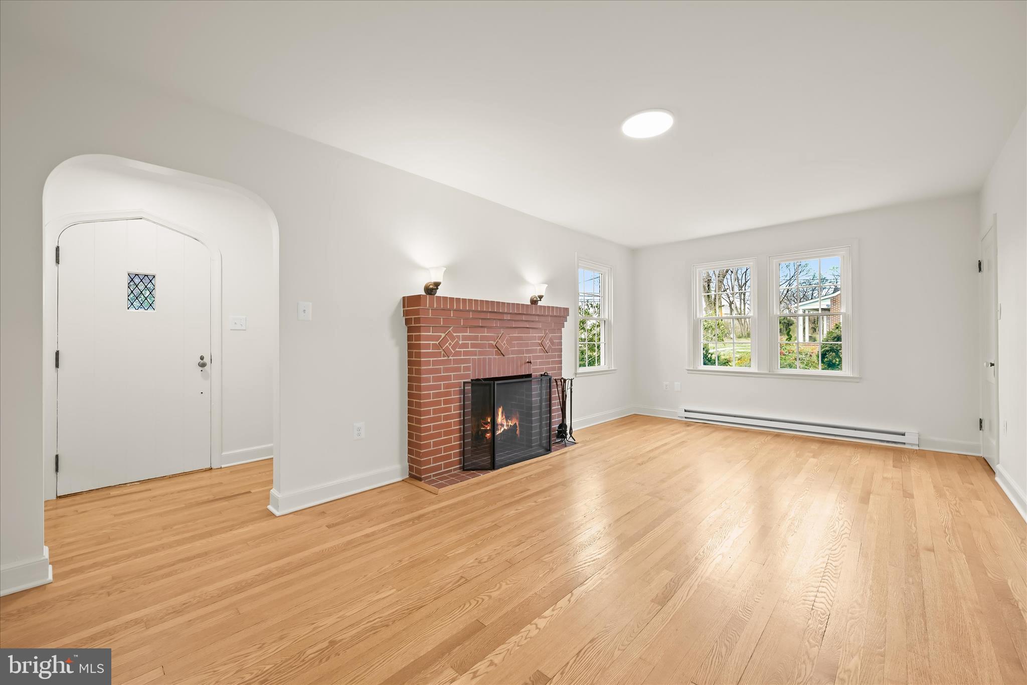1631 Shookstown Road Frederick, MD 21702 - Photo 9 of 69 an empty room with windows and fireplace