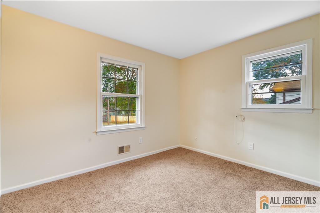 106 Farragut Avenue Middlesex, NJ 08846 - Photo 11 of 25 a view of an empty room with a window