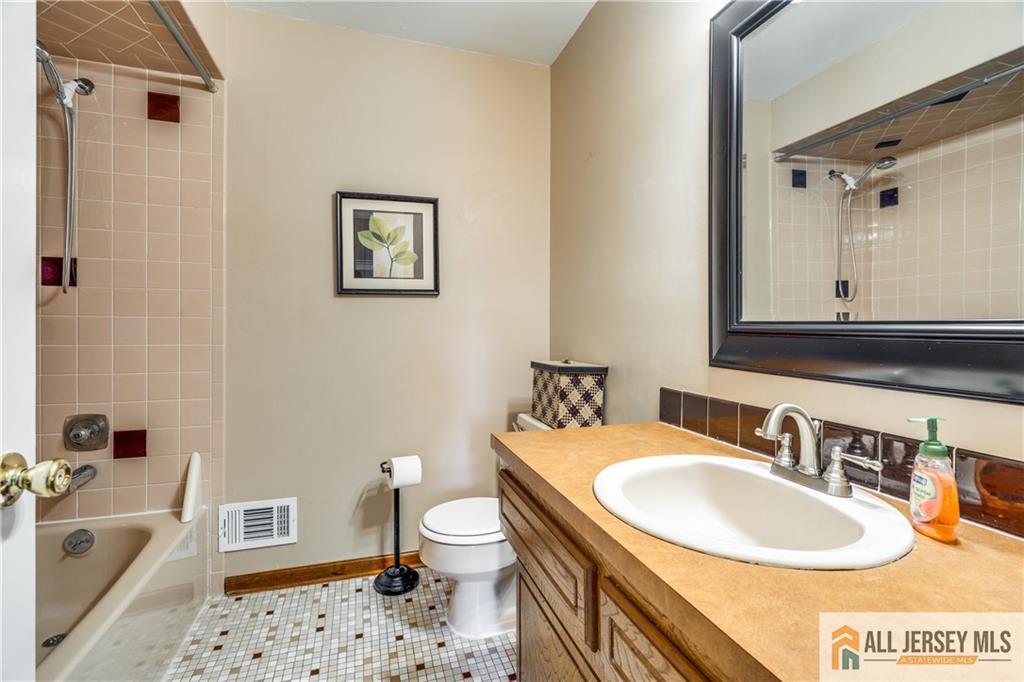 106 Farragut Avenue Middlesex, NJ 08846 - Photo 12 of 25 a bathroom with a sink toilet and shower