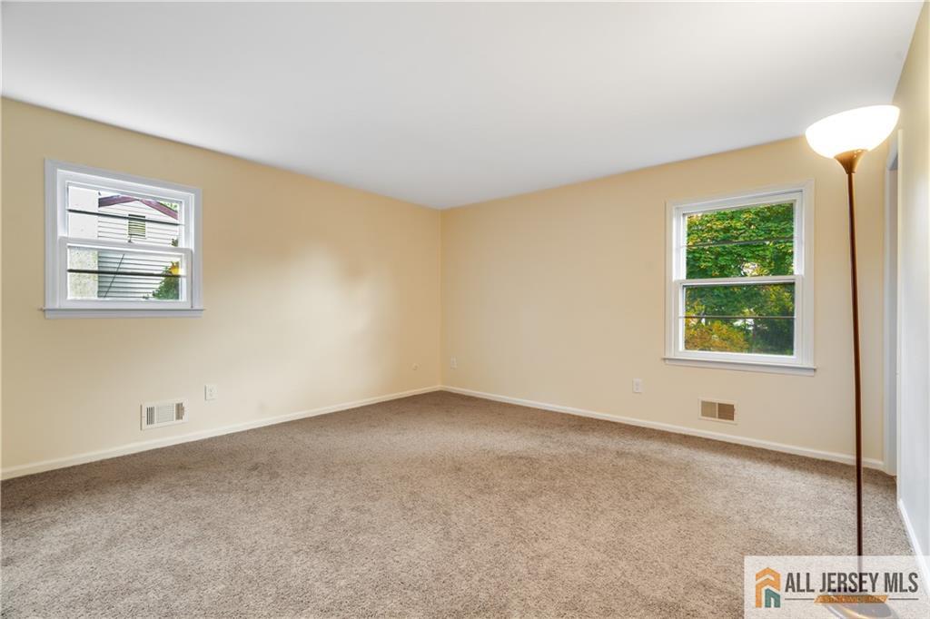 106 Farragut Avenue Middlesex, NJ 08846 - Photo 13 of 25 an empty room with windows