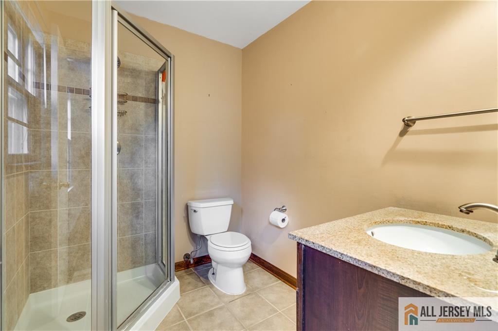 106 Farragut Avenue Middlesex, NJ 08846 - Photo 14 of 25 a bathroom with a granite countertop sink toilet and shower