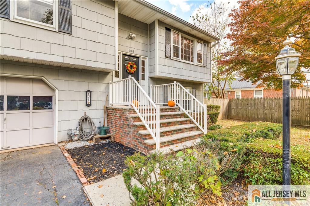 106 Farragut Avenue Middlesex, NJ 08846 - Photo 2 of 25 a front view of a house with a yard