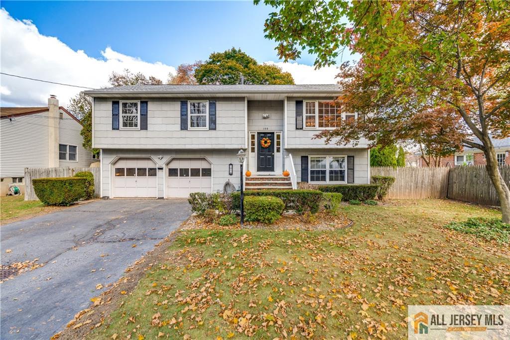 106 Farragut Avenue Middlesex, NJ 08846 - Photo 22 of 25 a front view of a house with a garden