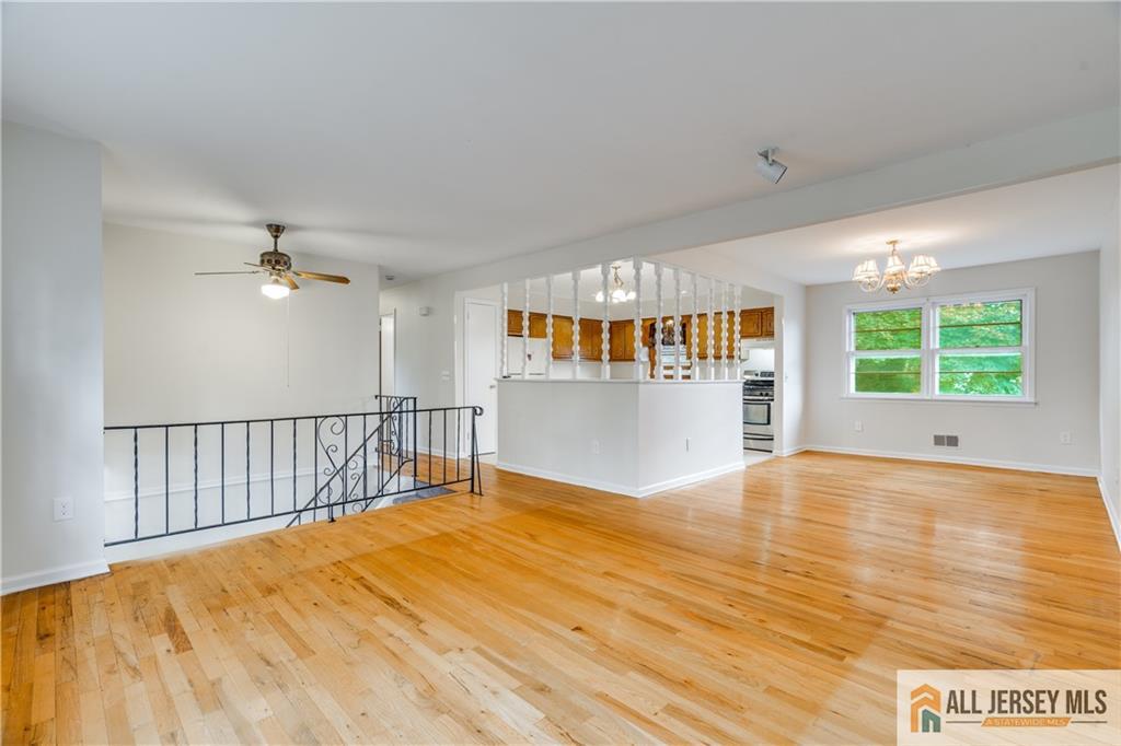 106 Farragut Avenue Middlesex, NJ 08846 - Photo 4 of 25 a view of a room with wooden floor and windows