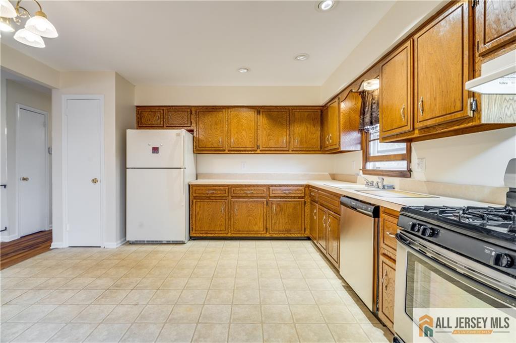 106 Farragut Avenue Middlesex, NJ 08846 - Photo 8 of 25 a kitchen with a cabinets and appliances