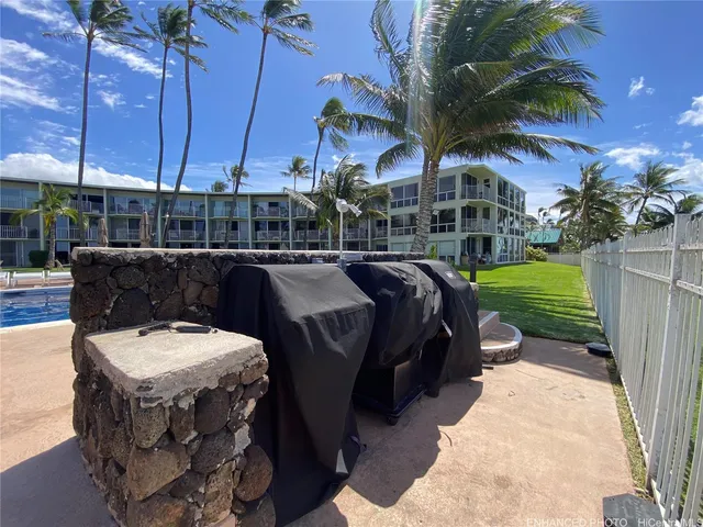 a couple of cars parked in front of retail shop
