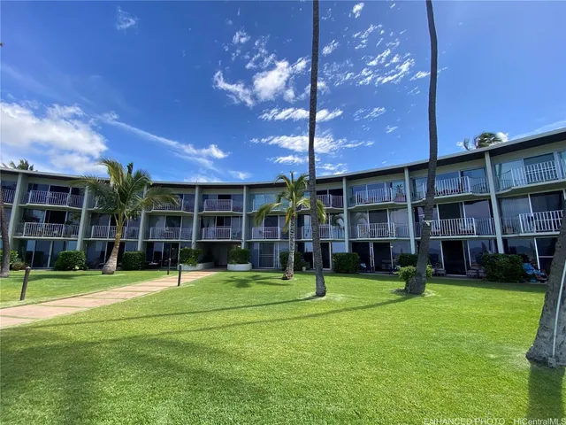 a view of a building with a big yard