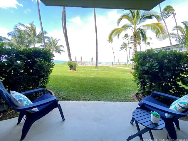 a view of a backyard and swimming pool