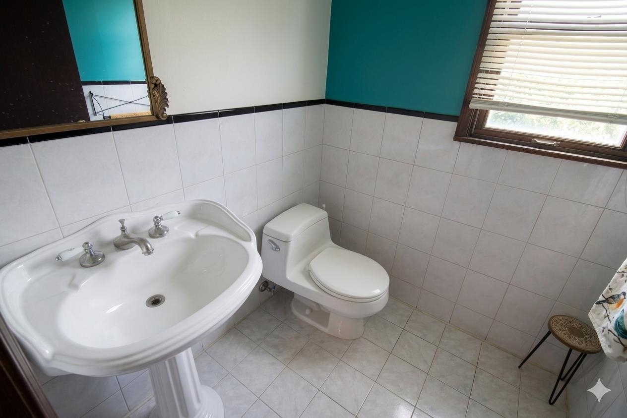 730 Humboldt Street, Unit 2 Secaucus, NJ 07094 - Photo 11 of 28 a bathroom with a sink and a toilet