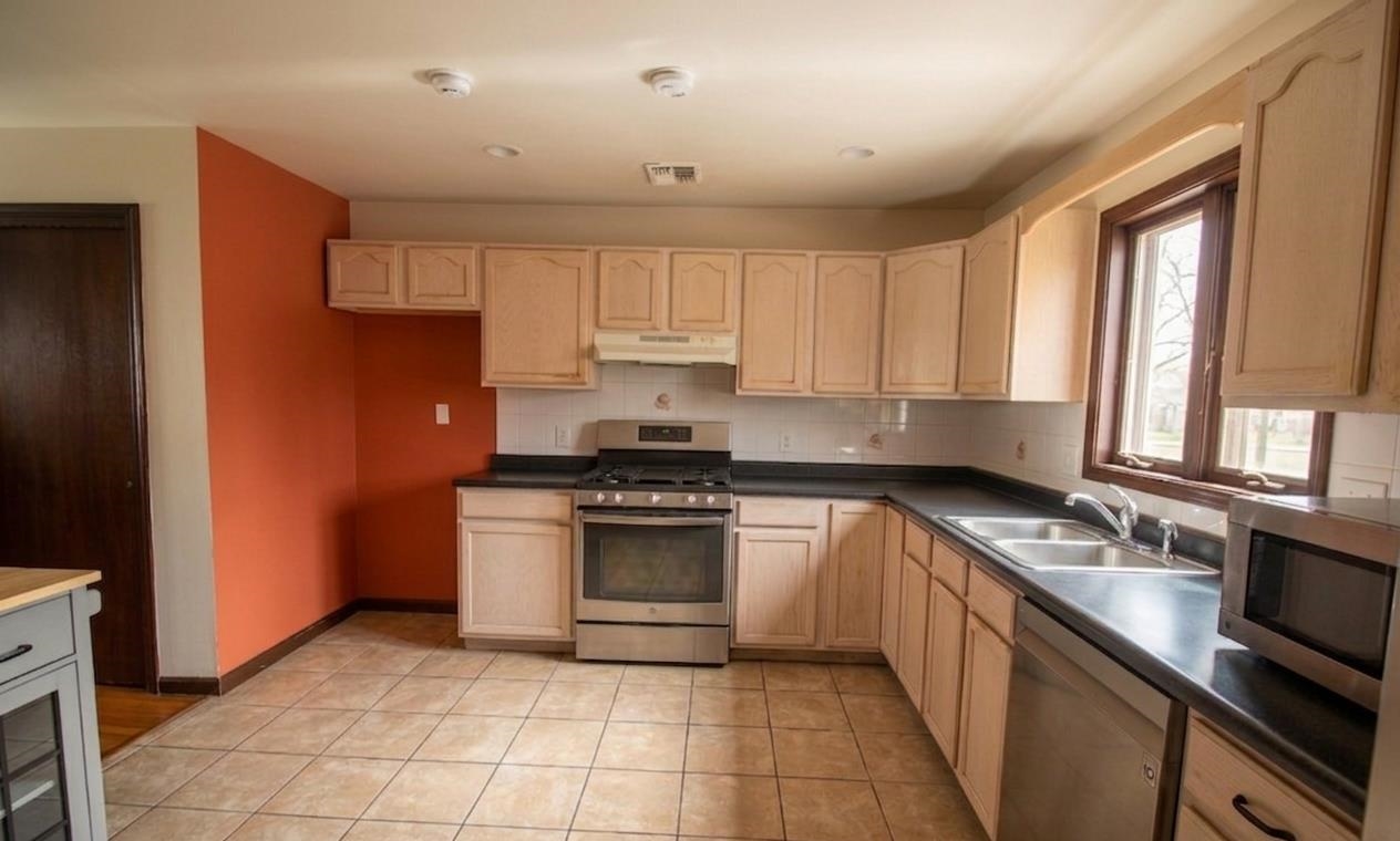 730 Humboldt Street, Unit 2 Secaucus, NJ 07094 - Photo 2 of 28 a kitchen with a sink stove top oven and cabinets