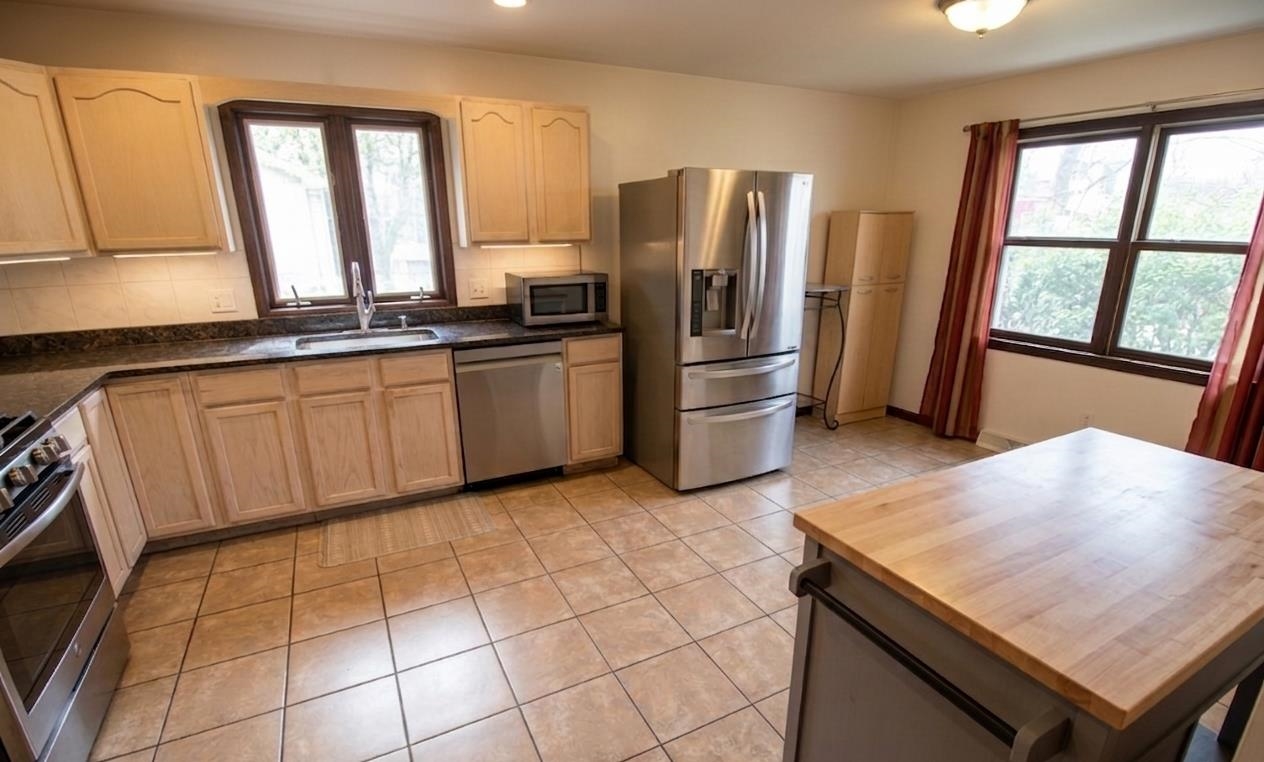 730 Humboldt Street, Unit 2 Secaucus, NJ 07094 - Photo 3 of 28 a kitchen with stainless steel appliances a refrigerator and a sink