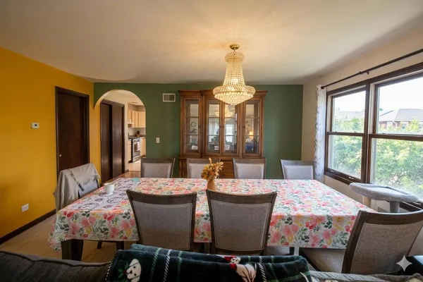 a view of a dining room with furniture window and outside view