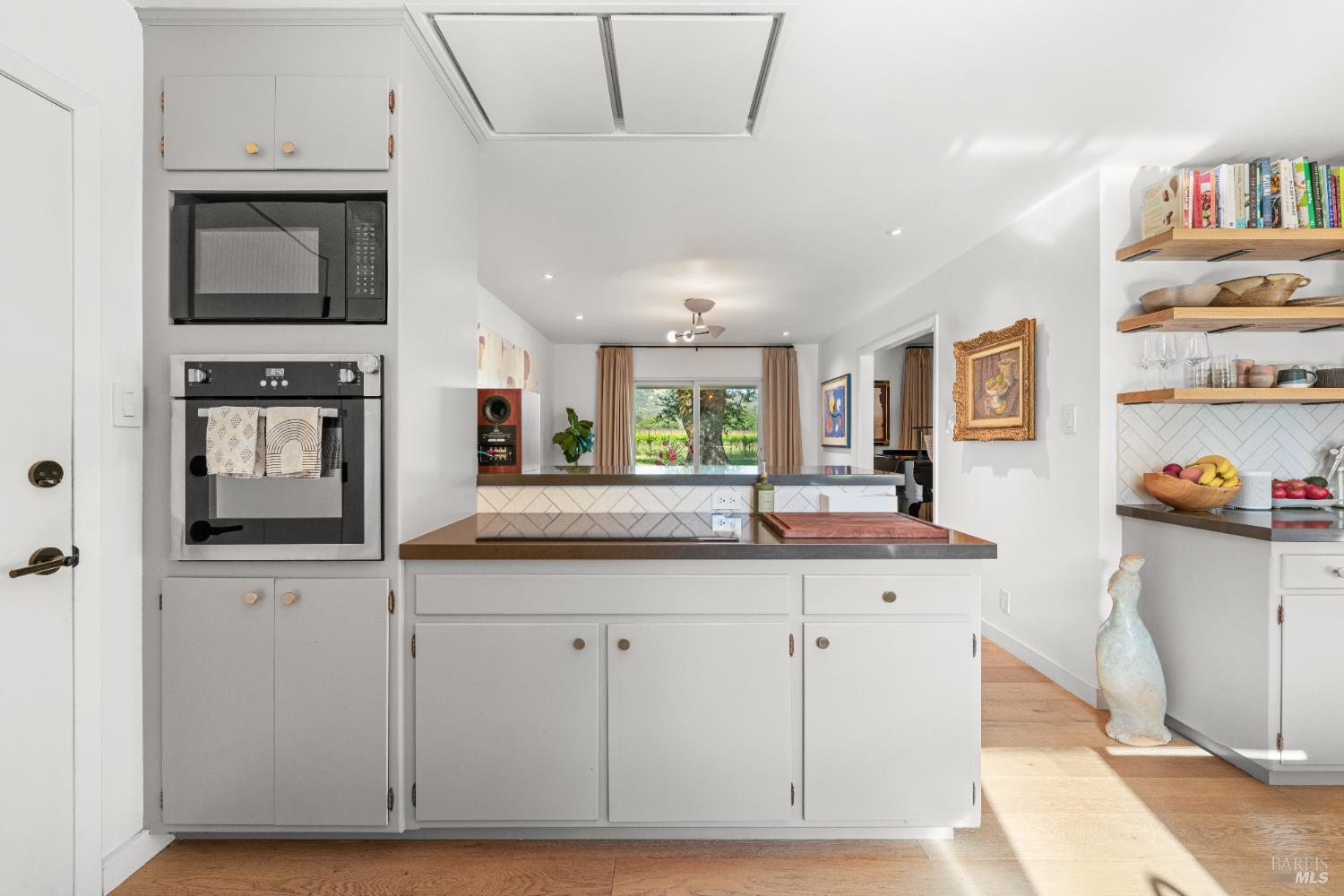 21800 River Road Geyserville, CA 95441 - Photo 12 of 30 a kitchen with stainless steel appliances granite countertop a stove a sink and a microwave