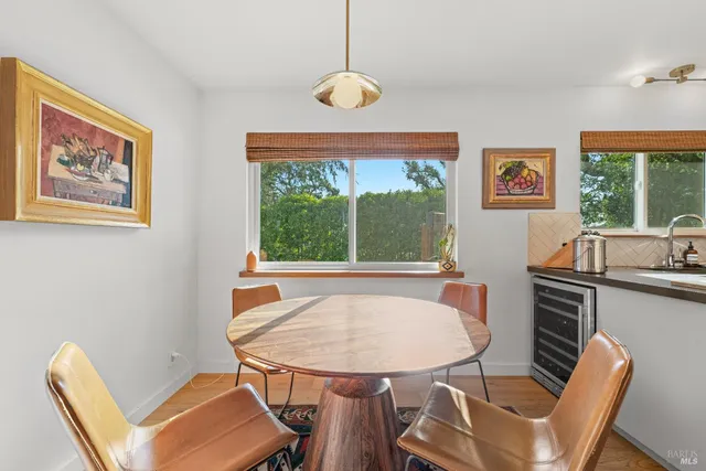 a view of a dining room with furniture window and outside view