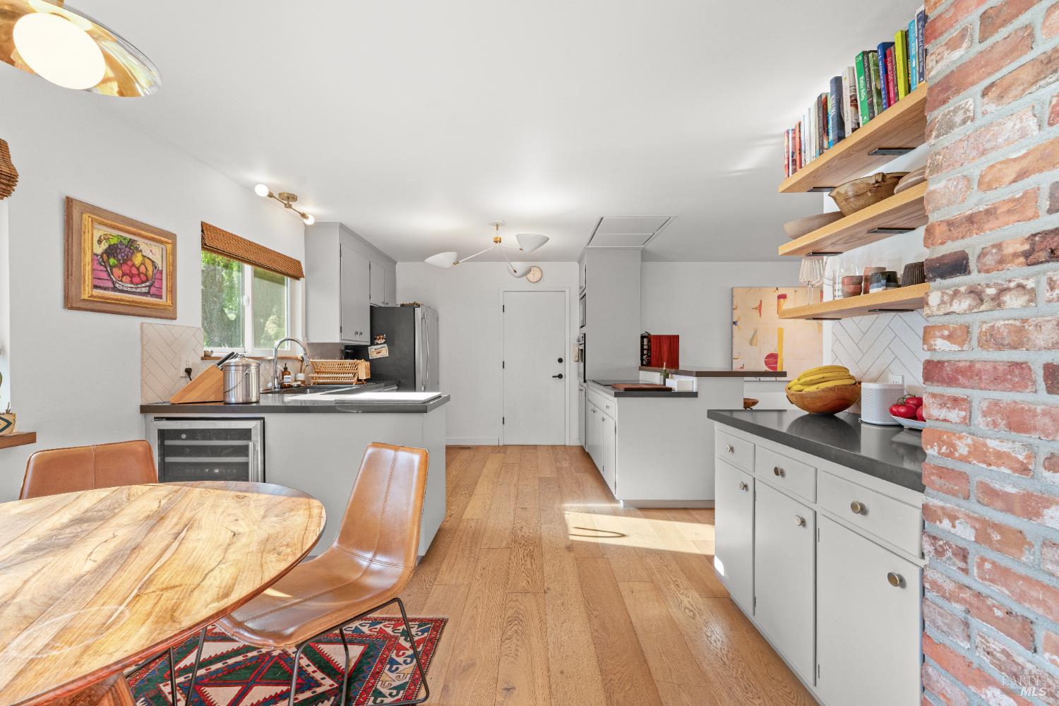 21800 River Road Geyserville, CA 95441 - Photo 16 of 30 a kitchen with stainless steel appliances kitchen island granite countertop a sink and cabinets