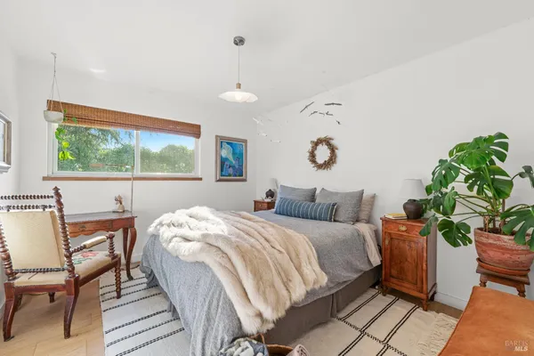 a bedroom with a bed and a table