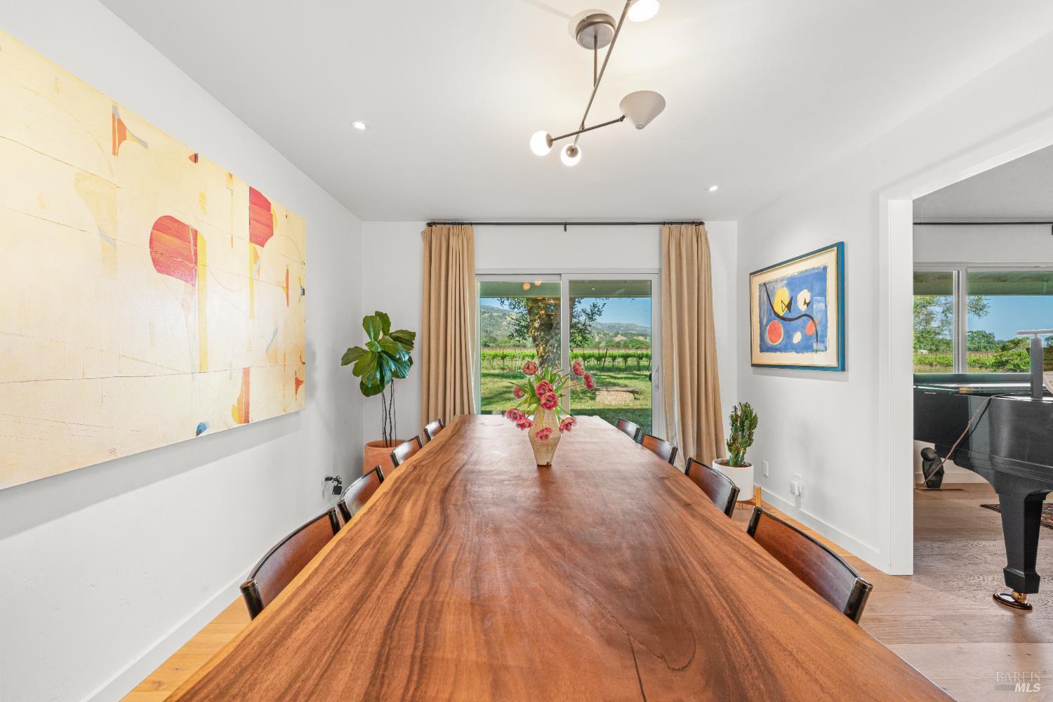21800 River Road Geyserville, CA 95441 - Photo 8 of 30 a spacious bedroom with wooden floor and large window