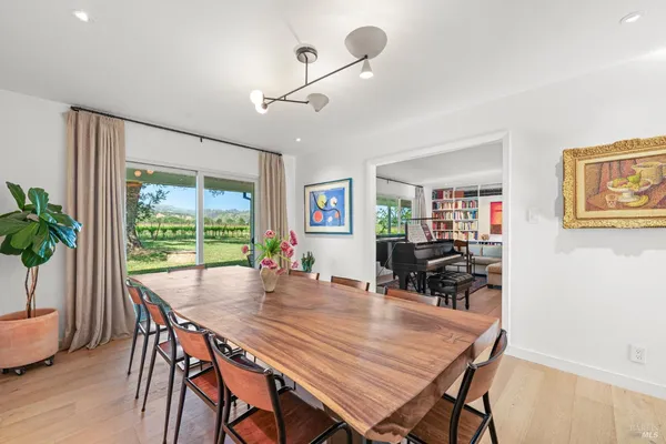 a dining room with furniture and window