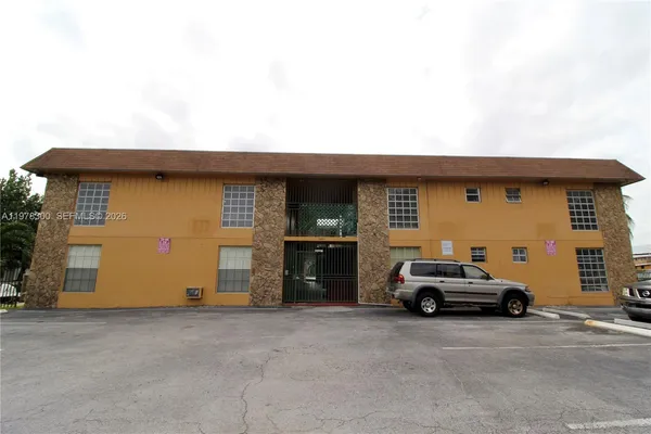 a view of a car parked in front of a house