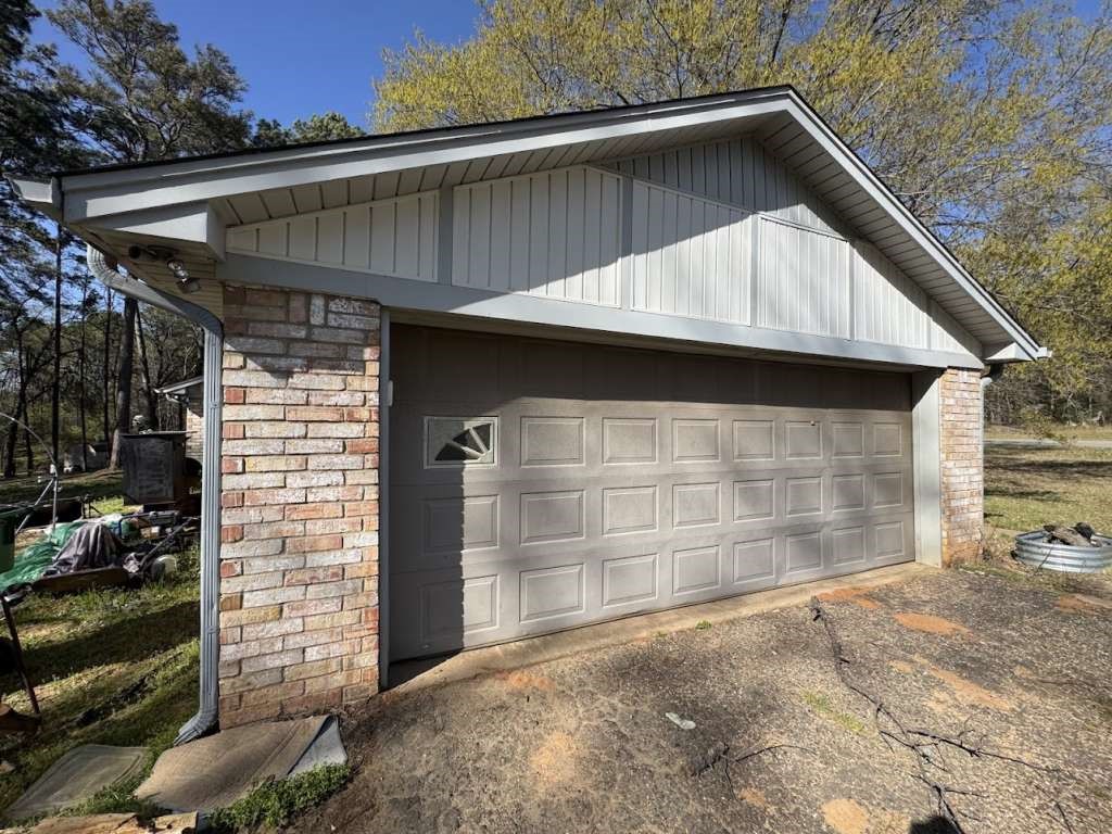 447 Plum Creek Road Longview, TX 75605 - Photo 2 of 4 a side view of a house with a garage
