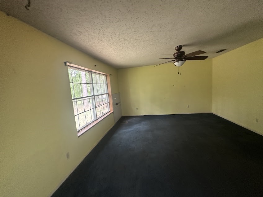 447 Plum Creek Road Longview, TX 75605 - Photo 7 of 11 an empty room with a window