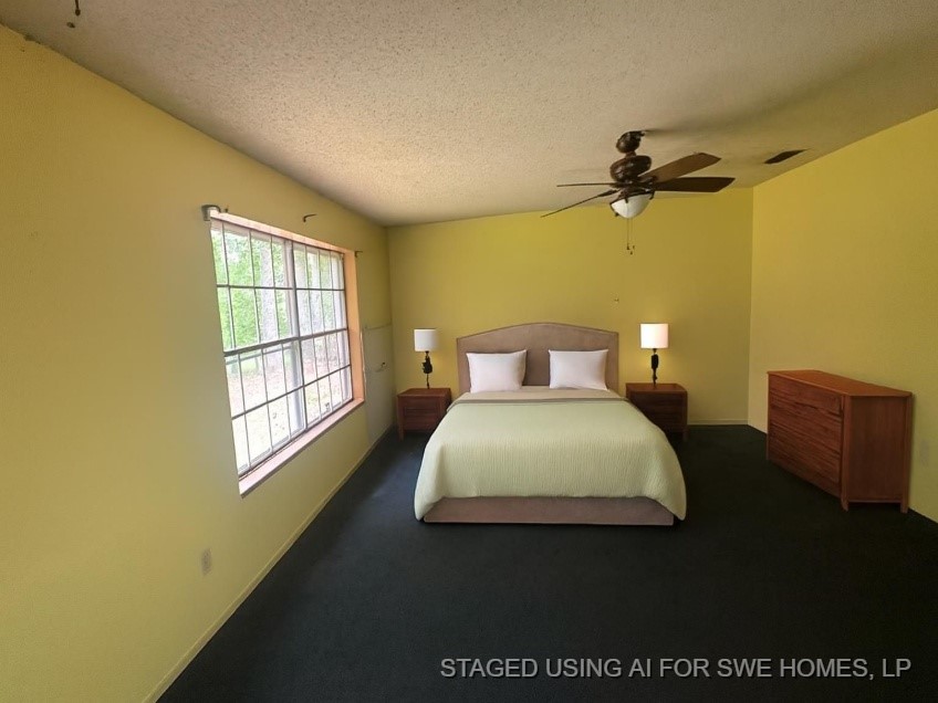 447 Plum Creek Road Longview, TX 75605 - Photo 8 of 11 a bedroom with a bed and a window