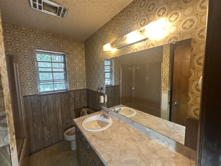 447 Plum Creek Road Longview, TX 75605 - Photo 9 of 11 a bathroom with a sink and a mirror